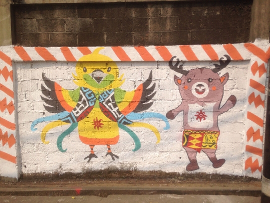 Pasukan oranye gambar mural Asian Games di Rawaterate