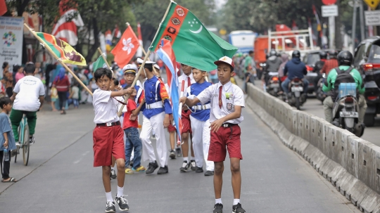 Antusias siswa SD saat sambut obor Asian Games 2018