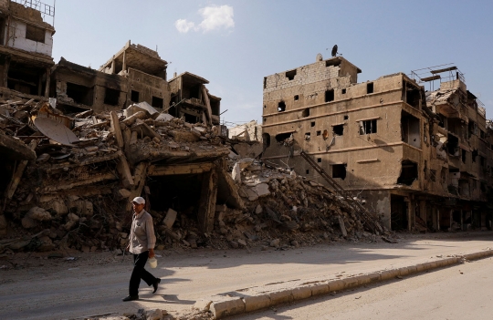 Kisah penjaga merpati bertahun-tahun bertahan dari perang Suriah