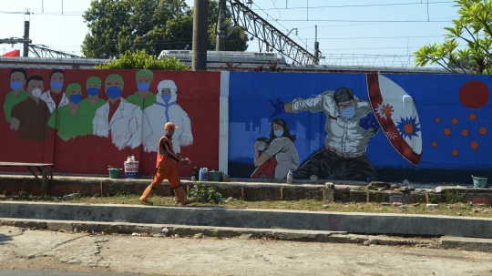 Pesan Mural Covid-19 di Bukit Duri untuk Masyarakat