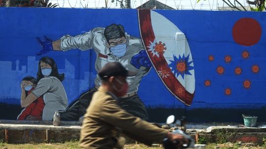 Pesan Mural Covid-19 di Bukit Duri untuk Masyarakat