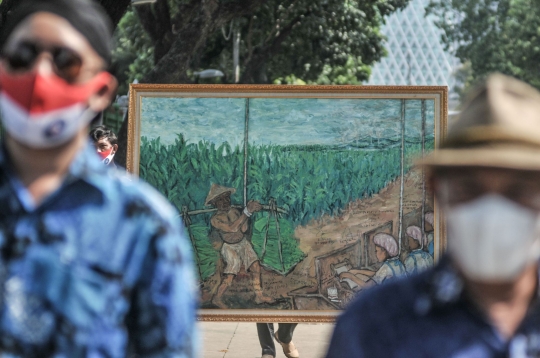 Aksi Petani Bawa Lukisan 'Jeritan Buruh Tembakau' ke Presiden Jokowi