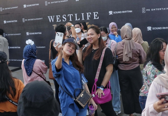 Antusiasme Penggemar Bernostalgia Bareng Westlife di GBK