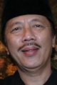 Profil Aom Kusman | Merdeka.com