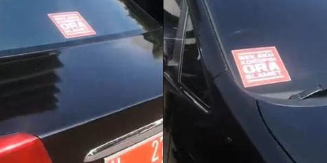 Pelajar Tempelkan Stiker Anti Korupsi Di Mobil Dinas Pemprov