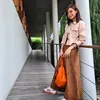 Najwa Shihab pakai Sneakers