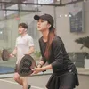 Esta Pramanita sedang fokus main padel
