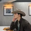 Potret S.Coups SEVENTEEN tampil dengan topi
