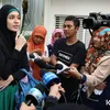 Dhini Aminarti berhijab