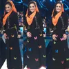 Krisdayanti Pakai Baju Muslim