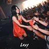 Potret DJ Una kenakan busana merah menantang.