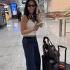Nia Ramadhani di bandara