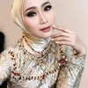 Ira Swara pakai baju emas