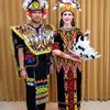Arumi Bachsin pakai baju dayak