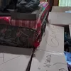 Pakaian Disiapkan dan Dikelompokkan dalam Kardus