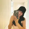 Min Hyo Rin Pakai Topi