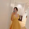 Min Hyo Rin Pakai Gaun Kuning