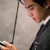 Potret Pesona Zhang Kangle Pakai Jas