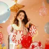 Pose Cantik dan Elegan di Tengah Dekorasi Bernuansa Pesta
