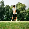 Sekala Bumi Fokus Saat Memukul Bola Golf