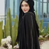 Inara Rusli pakai gamis hitam