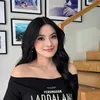 Titi Kamal Tersenyum