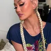 Agnez Mo Pakai Daster
