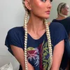 Agnez Mo Pakai Daster