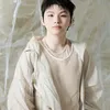 Woozi SEVENTEEN Pakai Baju Krem