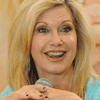 Olivia Newton John, Antara Rumah Sakit Kanker dan Buku Masakan