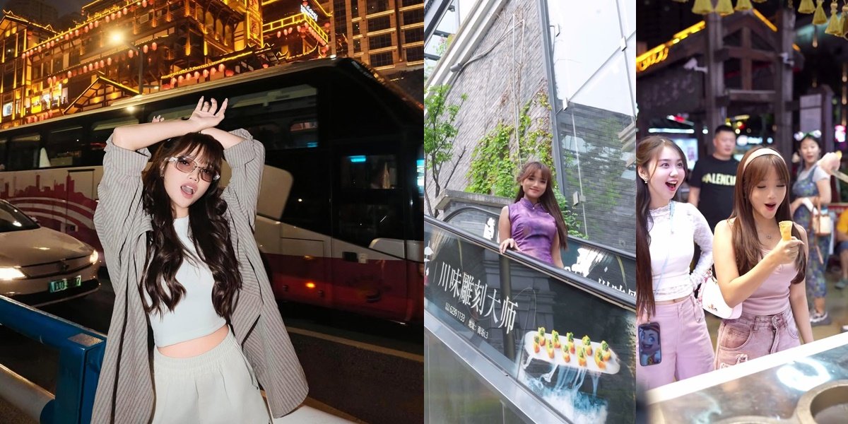 8 Photos of Fuji Traveling in China, Wearing a Cheongsam While Jumping Cutely