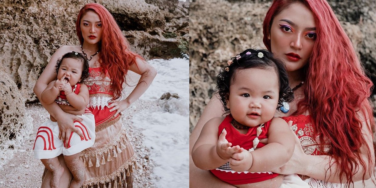 Posing in Moana Costume, Siti Badriah Radiates Hot Mom Charms While Carrying Baby Xarena on Bali Beach