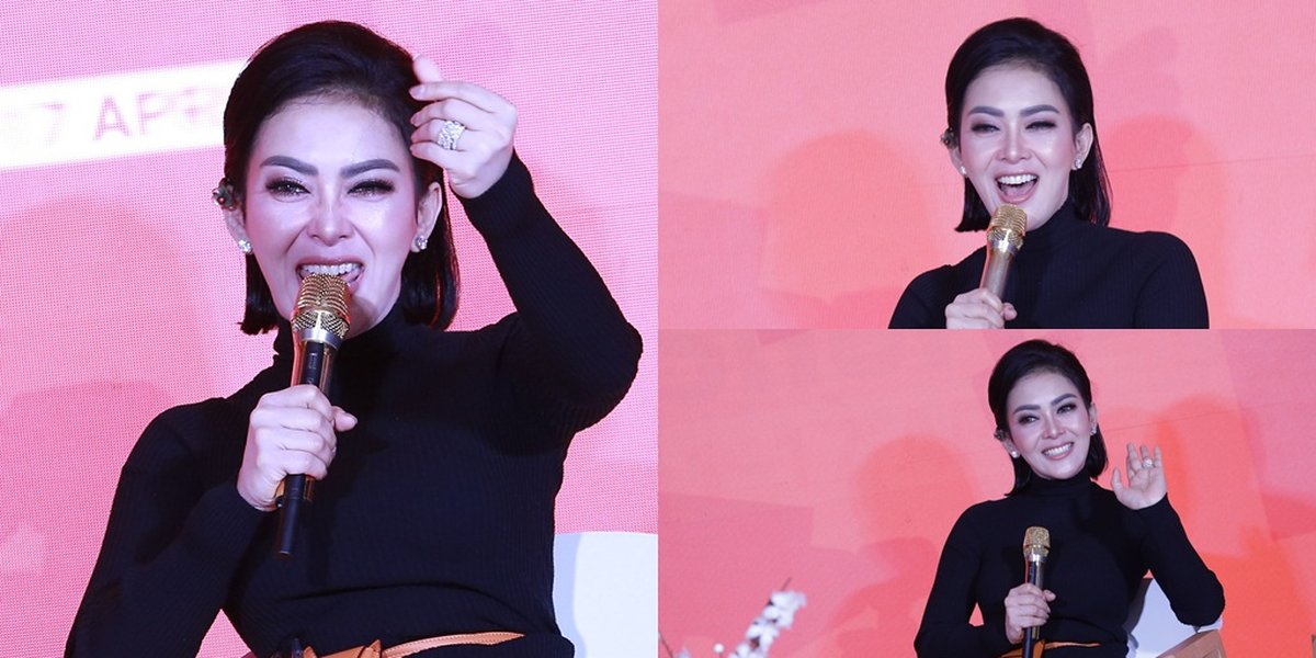 Syahrini's Cute Style at Shopee Event, Giving a Playful Finger Heart