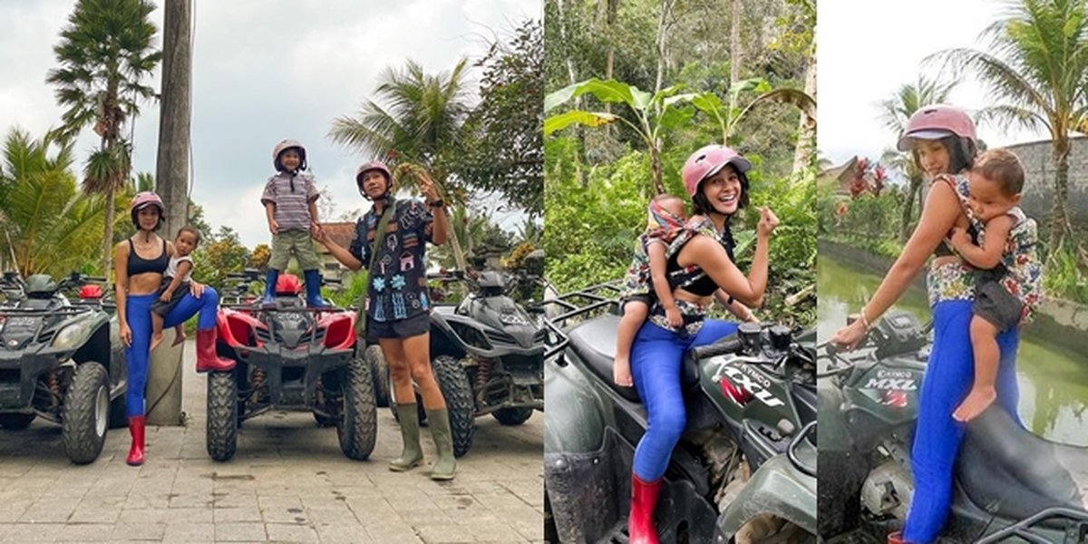 Vacation in Bali, Picture of Andien Having Fun Riding ATV While Carrying Her Child