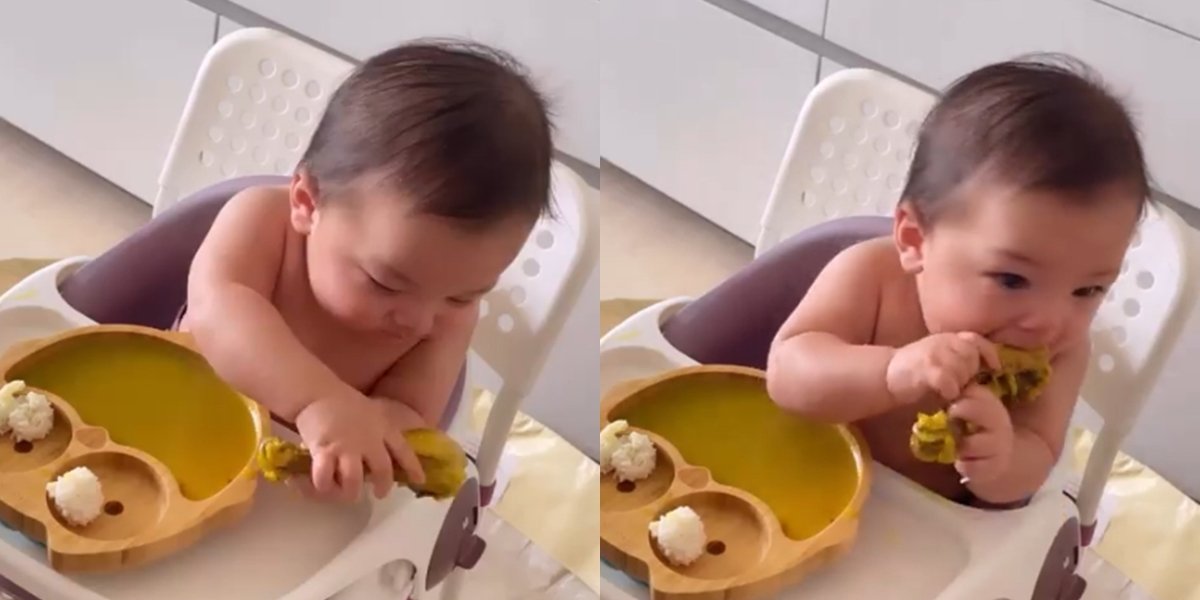 Portrait of Baby Izz, Nikita Willy's Child who has been Taught to Eat by Himself at the Age of 6 Months, Stirring Controversy for Devouring Chicken Thighs