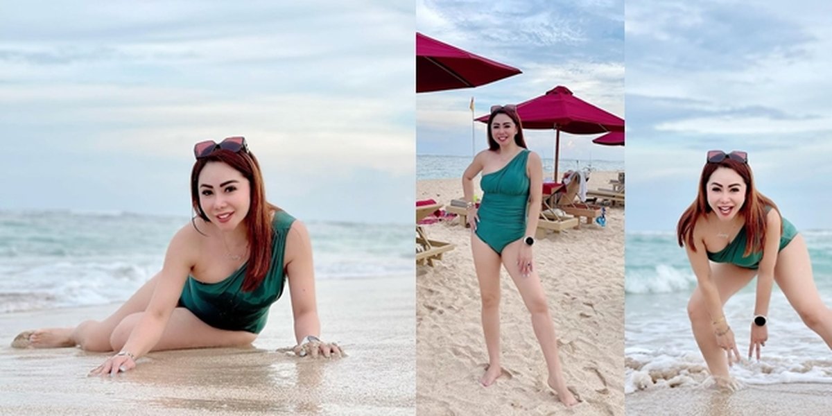 Portrait of Femmy Permatasari on Vacation in Bali, Hot in Bikini Showing Slim Legs on the Beach