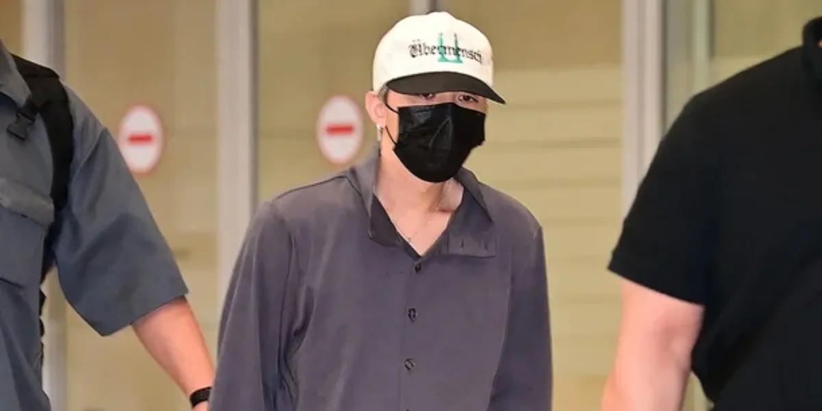 G-Dragon's Portrait Wearing First Class Korean Air Pajamas at the Airport