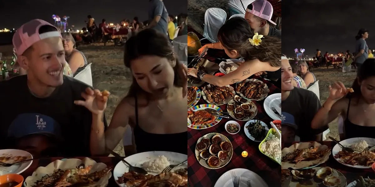 Portrait of Jennifer Coppen Eating by the Beach in Bali with Justin Hubner, Happy and Full of Smiles