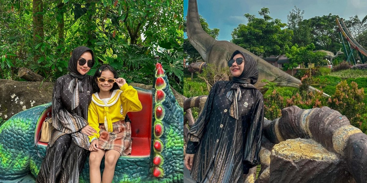 Portrait of Lala Widy Wearing Hijab While Accompanying Children on Vacation to Jatim Park