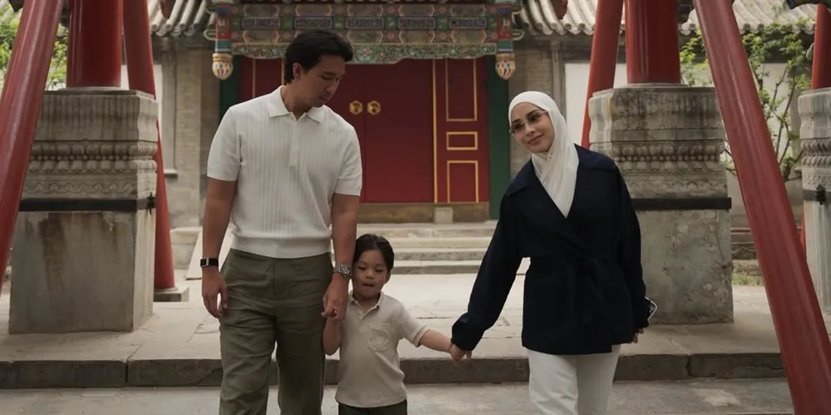 Portrait of Nikita Willy Pushing a Stroller During Vacation in China, Enjoying Family Moments
