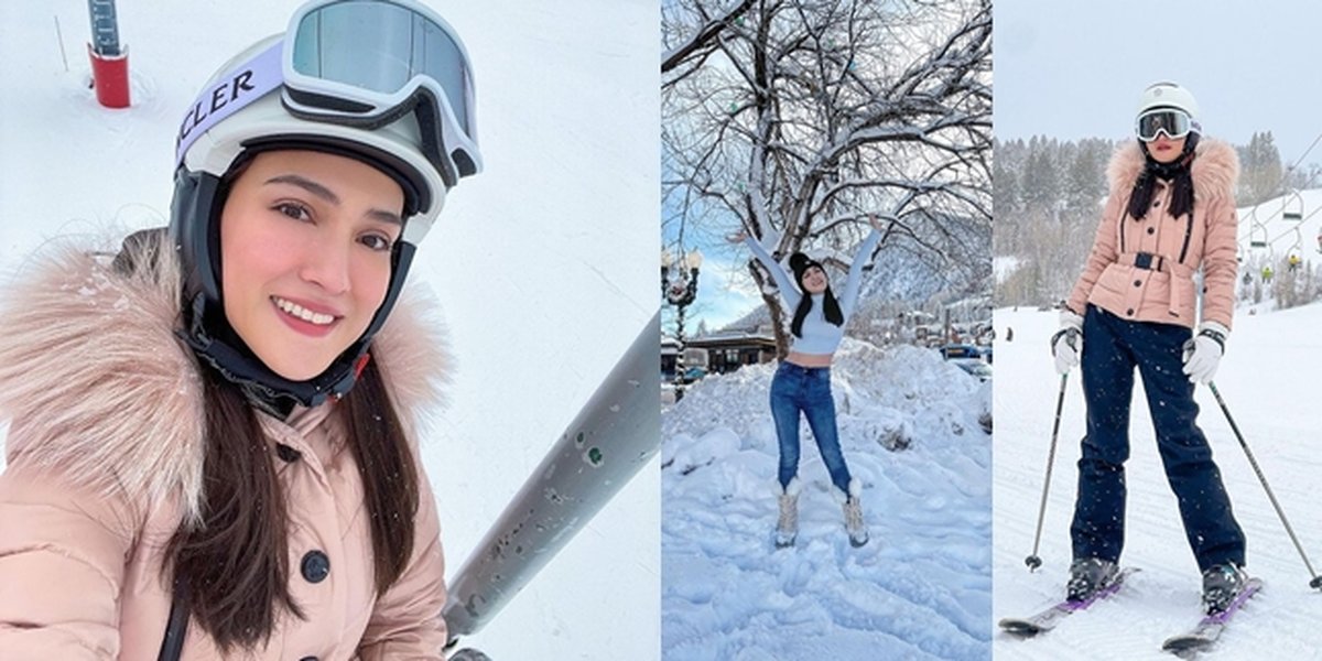 Shandy Aulia's Photos Playing in the Snow in Aspen, Learning to Ski - Relaxing while Wearing a Crop Top to Show Her Stomach in the Middle of the Snow