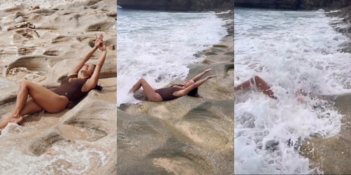 Reality Not as Beautiful as Instagram Posts, Take a Look at Jennifer Bachdim's Photoshoot Moment Getting Rolled by Waves at the Beach