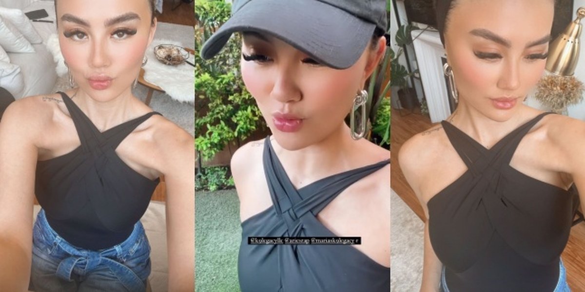 Previously Accused of Plastic Surgery, Sneak Peek at Agnez Mo's Different Look When Feminine Makeup - Wearing a Halter Neck Top Showing Tattoos on the Shoulder