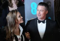 Kemesraan Angelina Jolie - Brad Pitt di Red Carpet BAFTA 2014