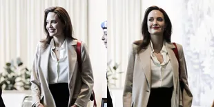 Kenakan Kaftan Putih, Angelina Jolie Ajak Vivienne Berbelanja Santai