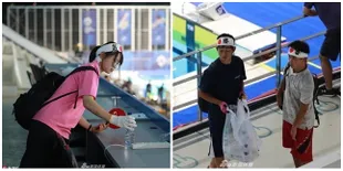 Salut! Tanpa Diminta, Suporter Jepang Bersihkan Arena Akuatik Asian Games 2018