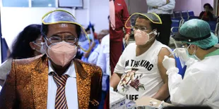 10 Potret Hotman Paris Terima Vaksin Covid-19 Bersama Sang Istri, Datang Pakai Setelan Jas Nyentrik