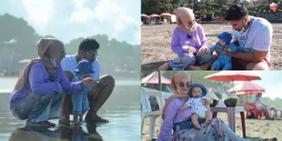 9 Potret Baby Air Anak Ammar Zoni dan Irish Bella Pergi ke Pantai Untuk Pertama Kalinya, Ekspresi Datarnya Bikin Gemas
