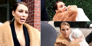 Kim Kardashian Gendong Anaknya Dengan Cara Aneh