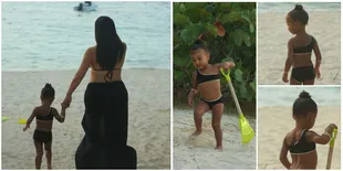 Main Pasir di Pantai, Kim Kardashian dan North West Duel Bikini